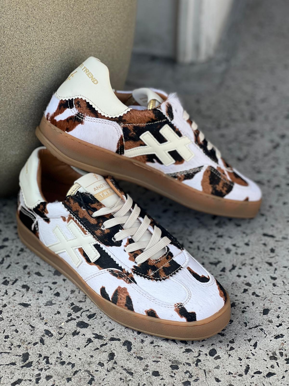 Lace Up Gum Sole Trainer in Cow Print