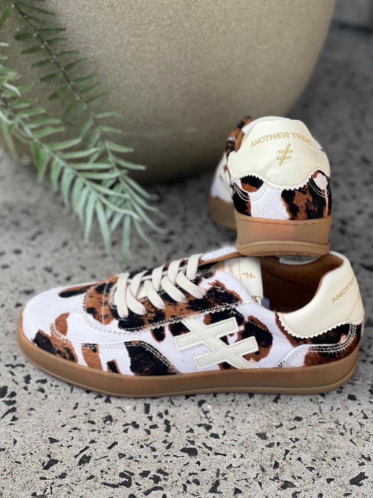 Lace Up Gum Sole Trainer in Cow Print