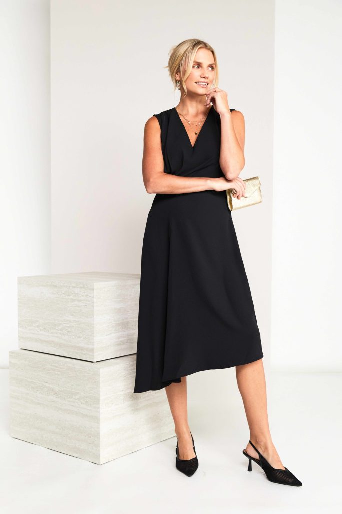 Sleeveless Vee Neck Dress With Angled Hemline in Black